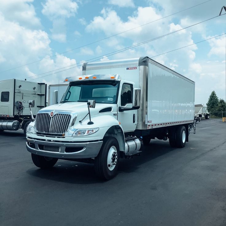 White 26-foot box truck (International MV)